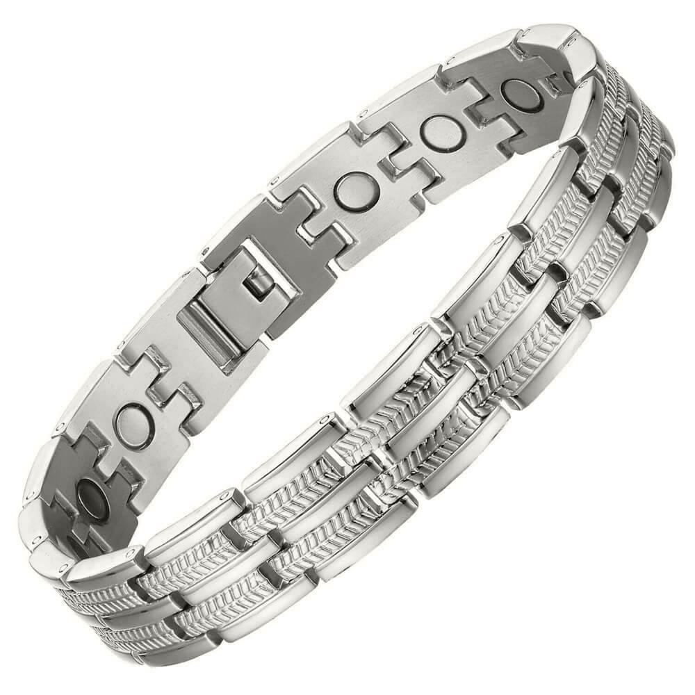 A silver-toned magnetic therapy link bracelet with a combination of smooth, polished rectangular links and textured chevron-patterned links, shown on a plain white background.