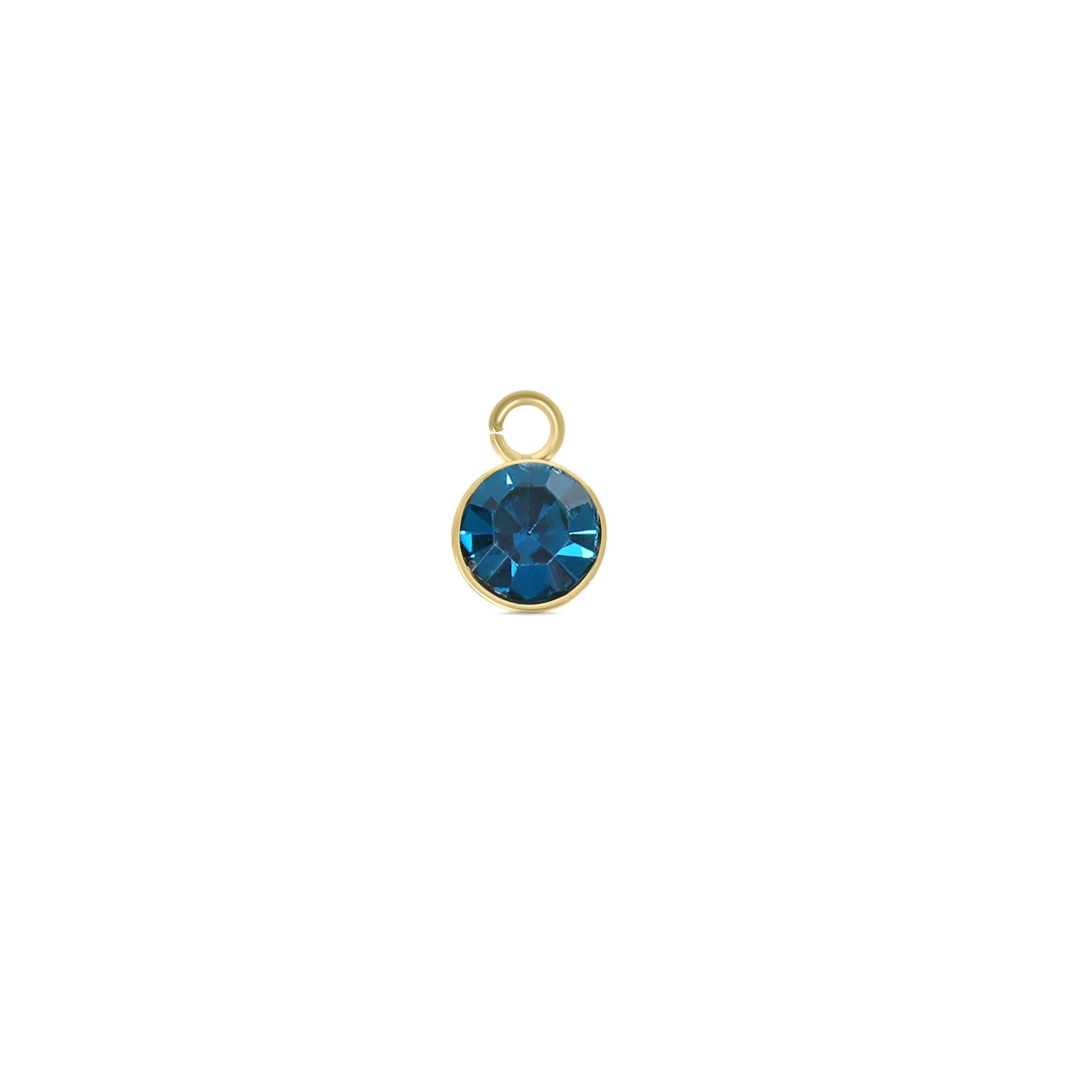 gold stainless steel birthstone charm with deep blue gemstone by Melchior Jewellery