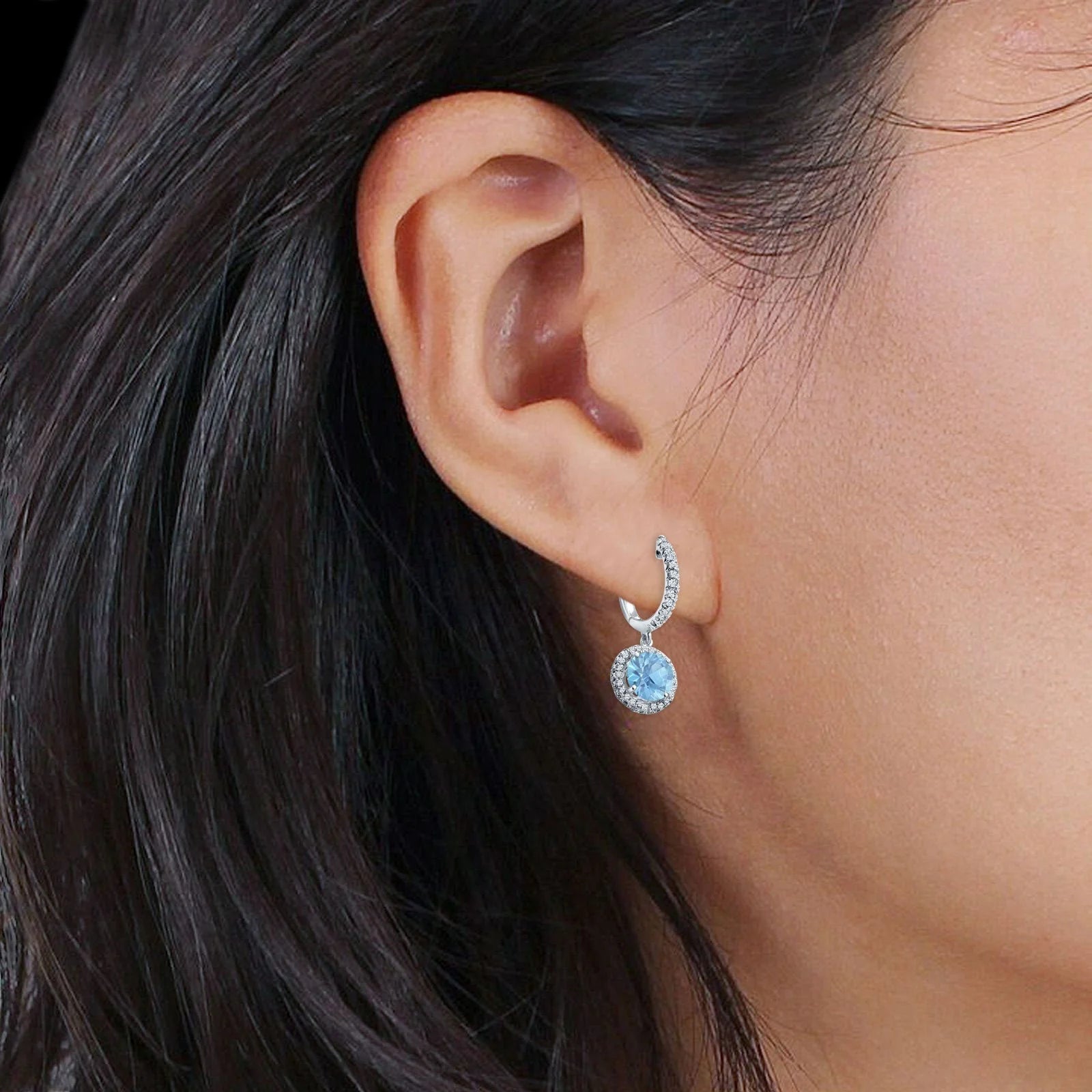 Melchior Jewellery Aquamarine Halo Huggie Drop Earrings in silver with light blue aquamarine stone and surrounding clear crystals