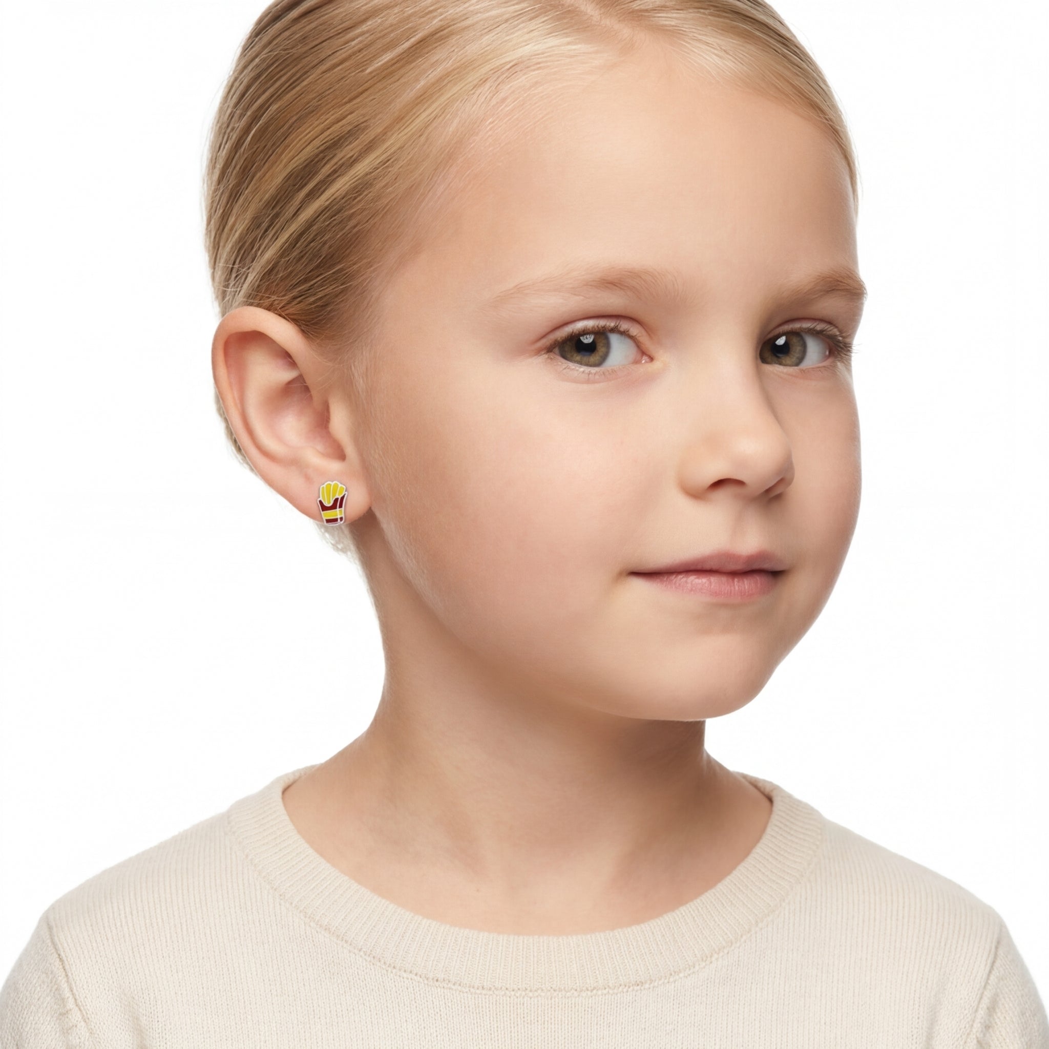 Girl wearing colourful yellow and red french fries stud earrings for kids by Melchior Jewellery