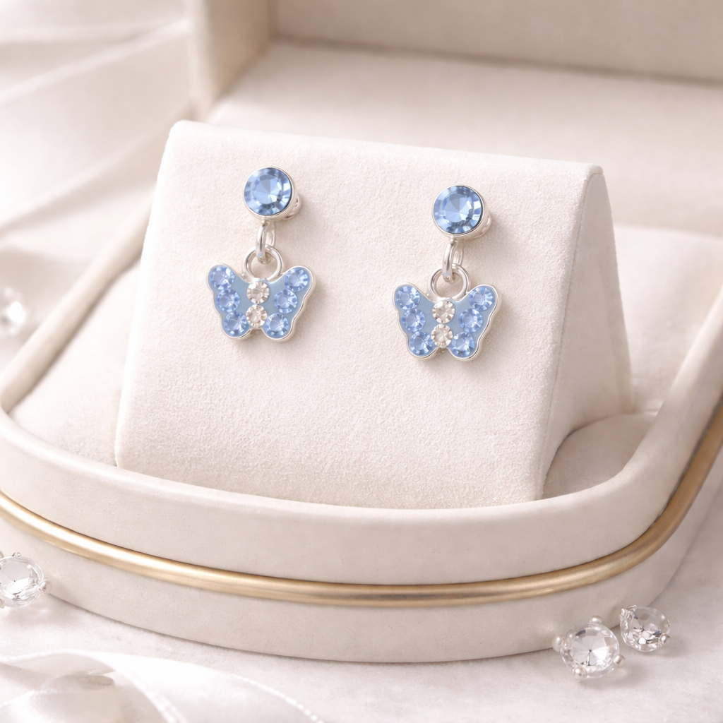 Melchior Jewellery delicate blue butterfly earrings with sparkling light blue crystals and silver setting