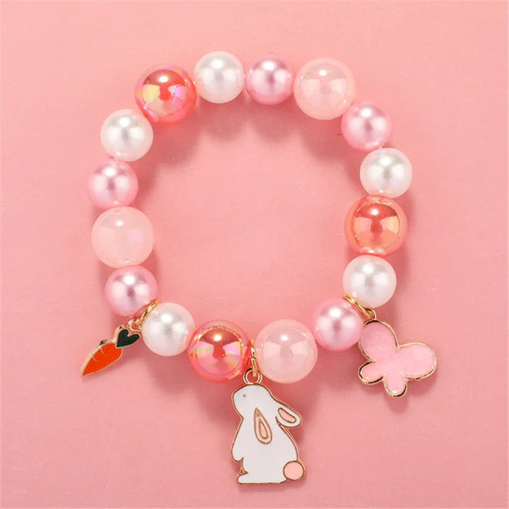 Melchior Jewellery children's rabbit bead bracelet with pink, white beads and rabbit, carrot, butterfly charms