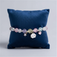 Melchior Jewellery cloud charm bracelet for kids with colourful beads and cute cloud charm on navy cushion
