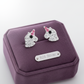 Crystal unicorn stud earrings for kids in 925 silver on purple jewellery display by Melchior Jewellery