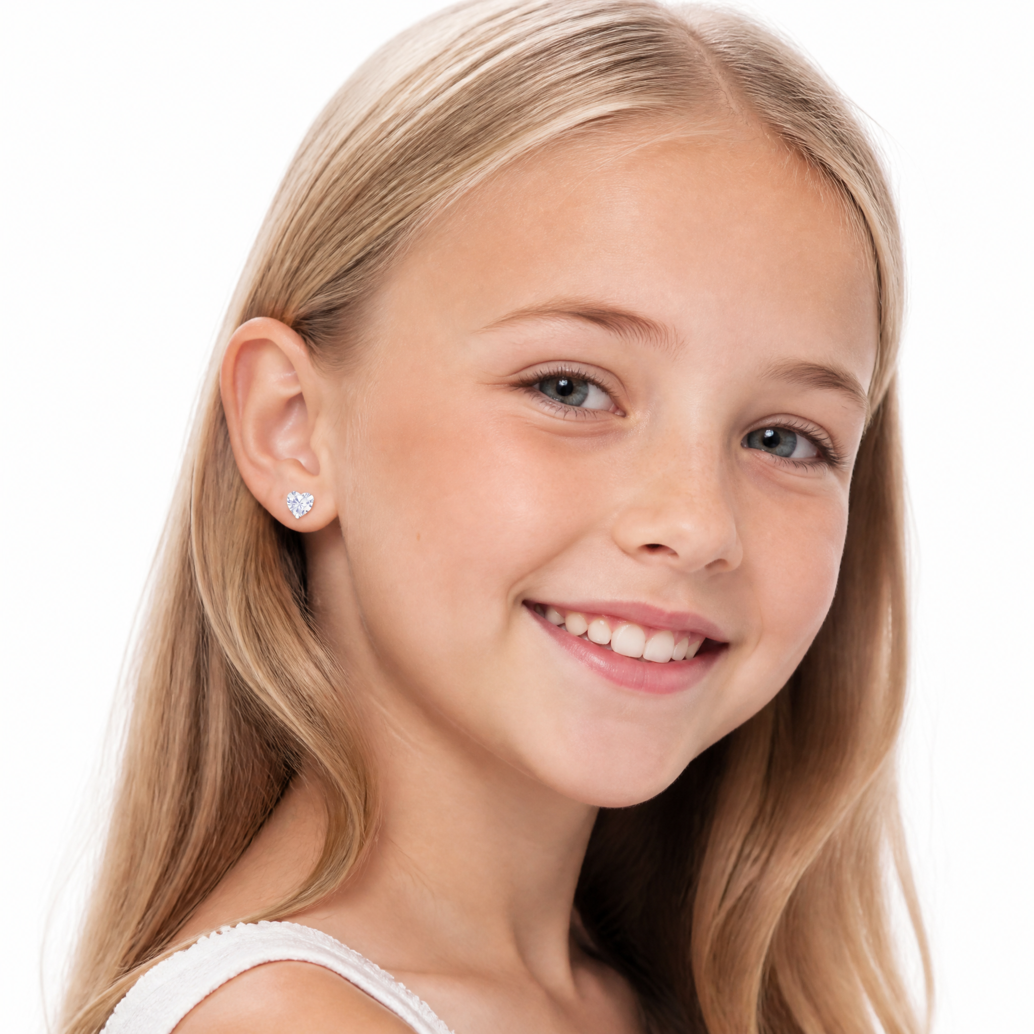 Young girl wearing sterling silver 6mm CZ heart screw back earrings against a white background