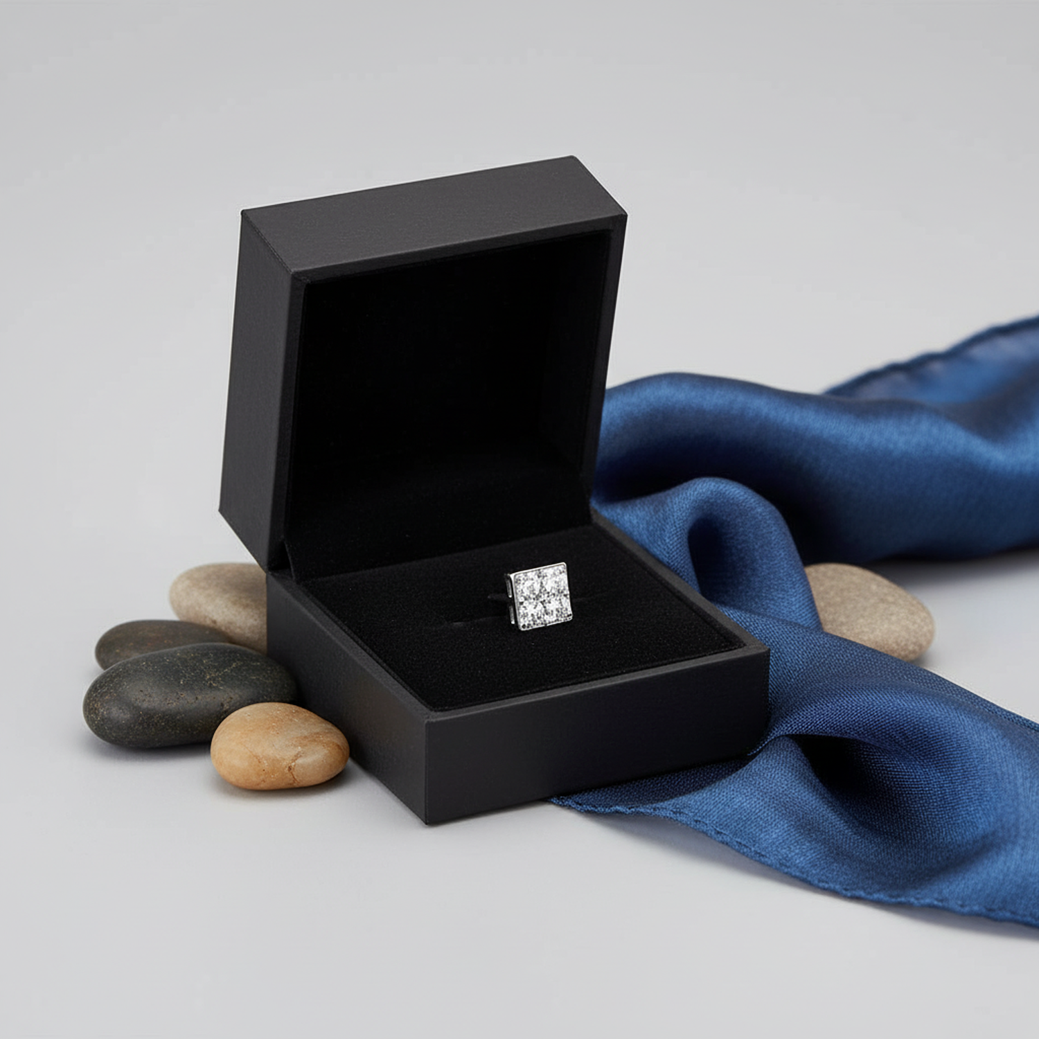 Sterling silver mens 4mm square cz stud single earring displayed in black box with blue fabric and stones