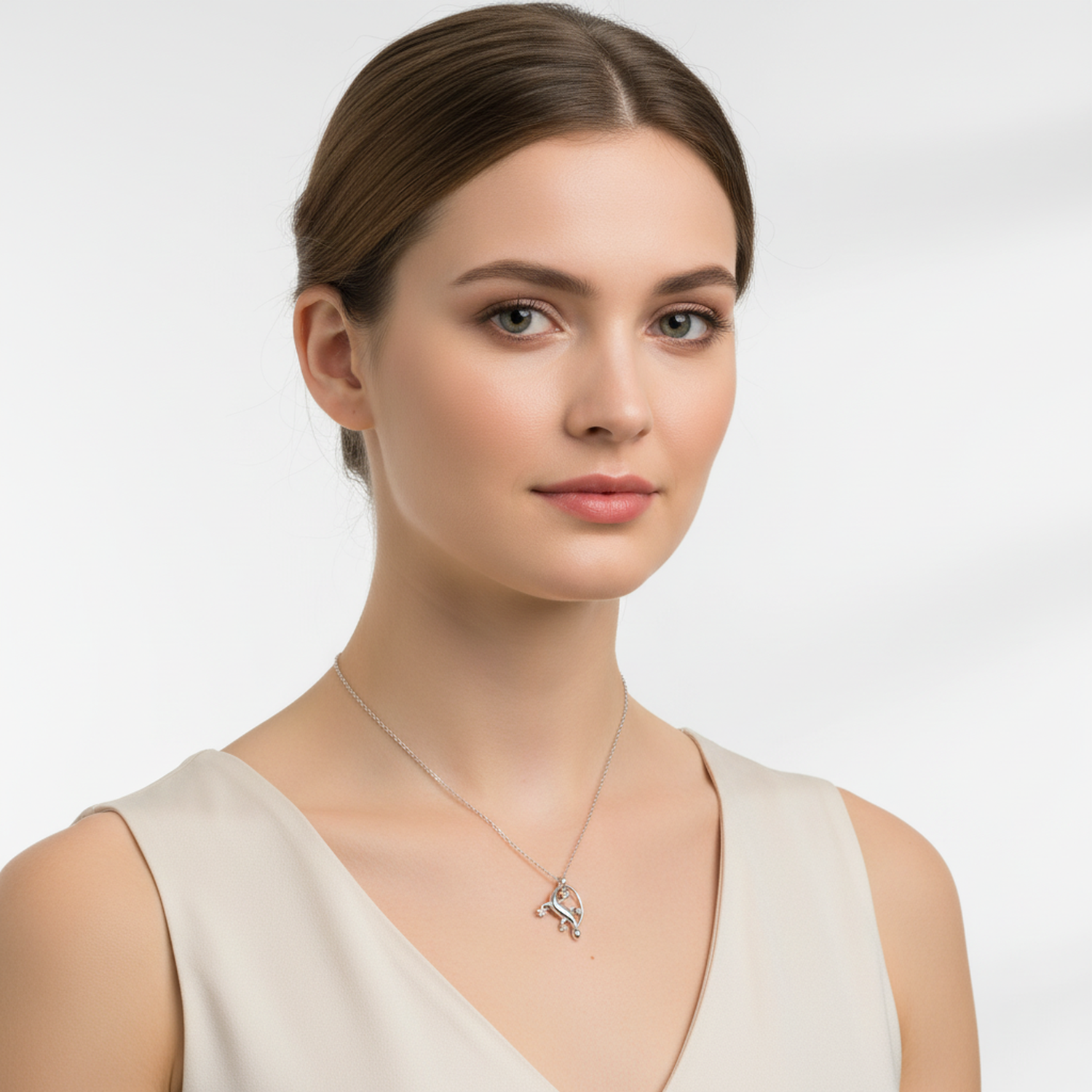 Elegant silver gecko charm necklace worn by woman with neutral top from Melchior Jewellery