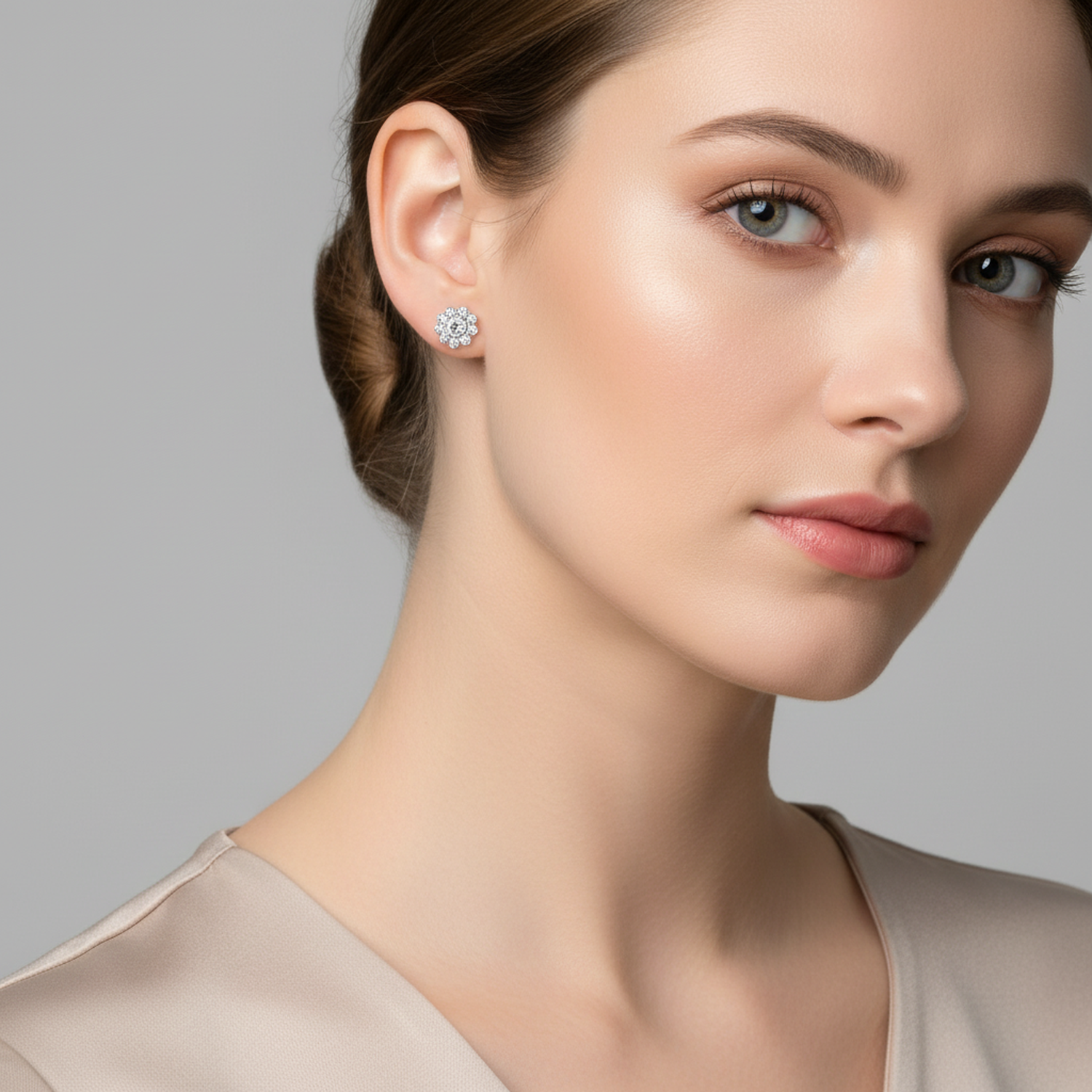 Womans sterling silver crystal flower stud earrings worn by model showcasing delicate floral design