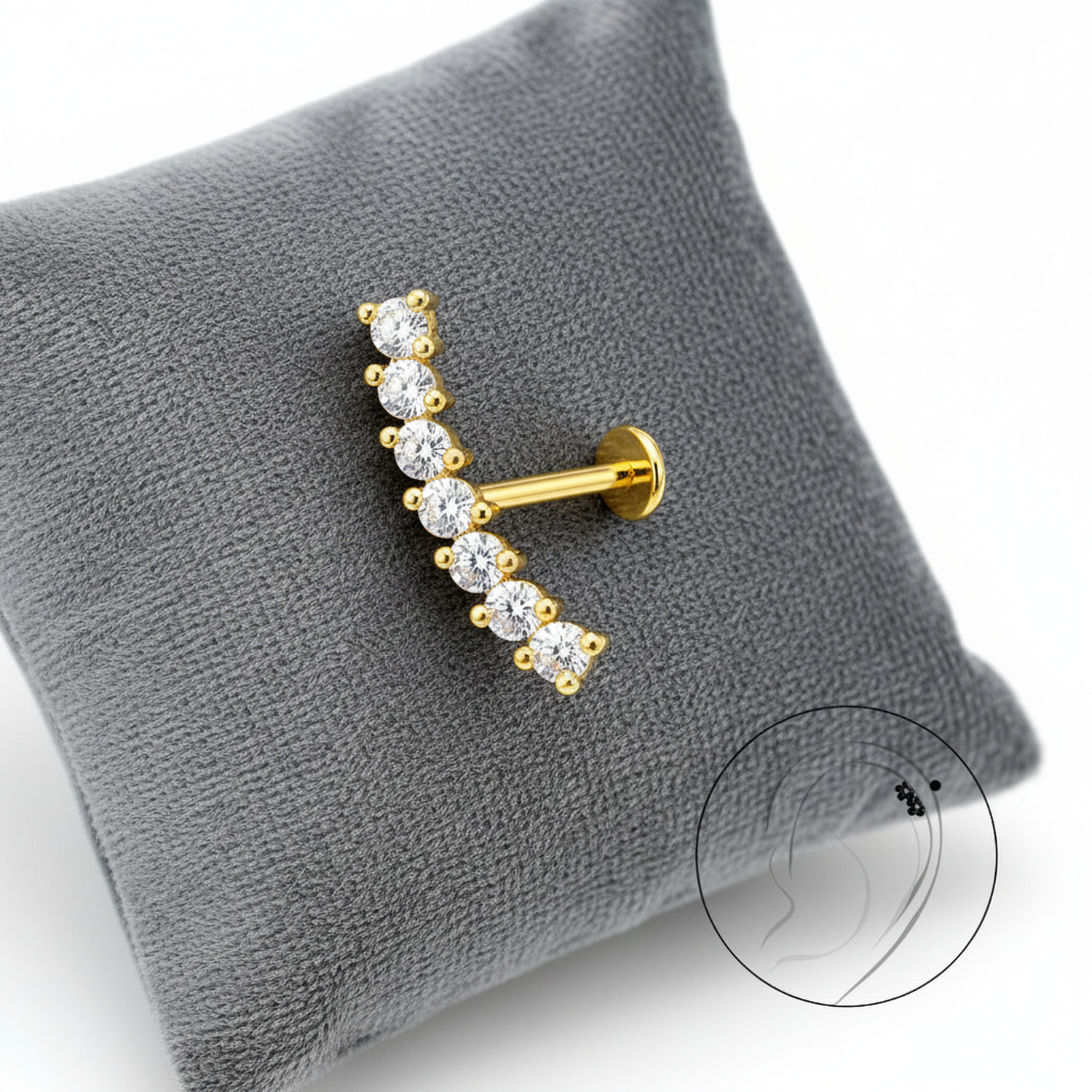 Gold labret earring silver titanium with clear stones displayed on grey cushion by Melchior Jewellery