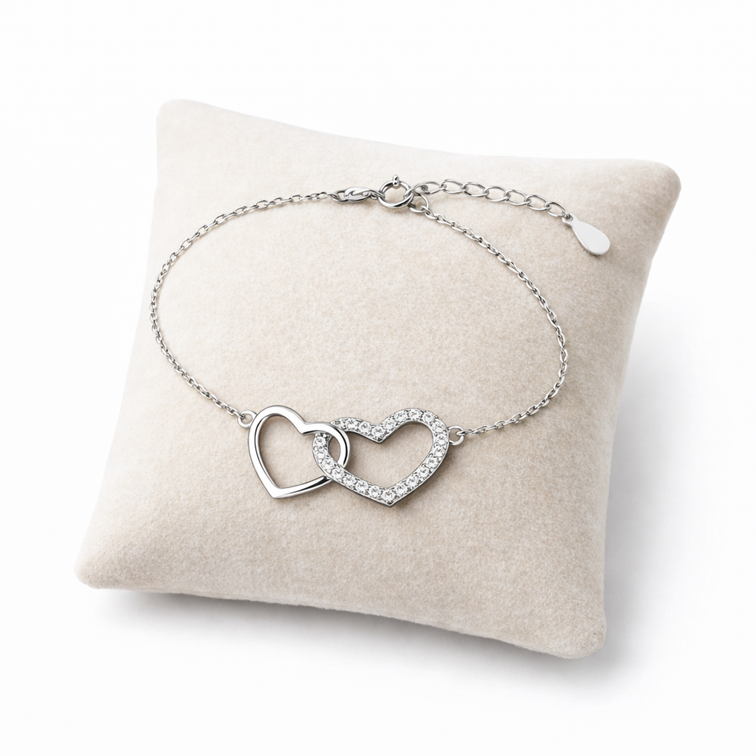 Sentiell sterling silver double heart bracelet with delicate chain and sparkling heart charms on plush cushion