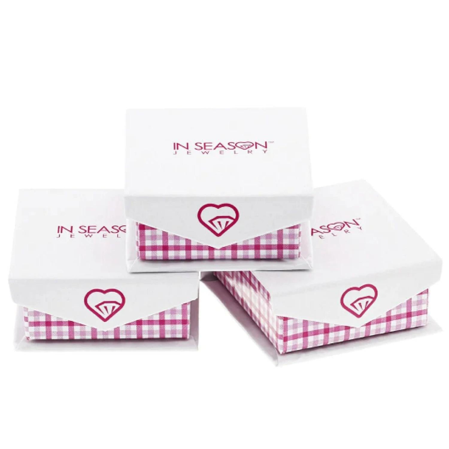 In Season Jewellery packaging for 14k gold cross earrings for girls in white and pink checkered boxes