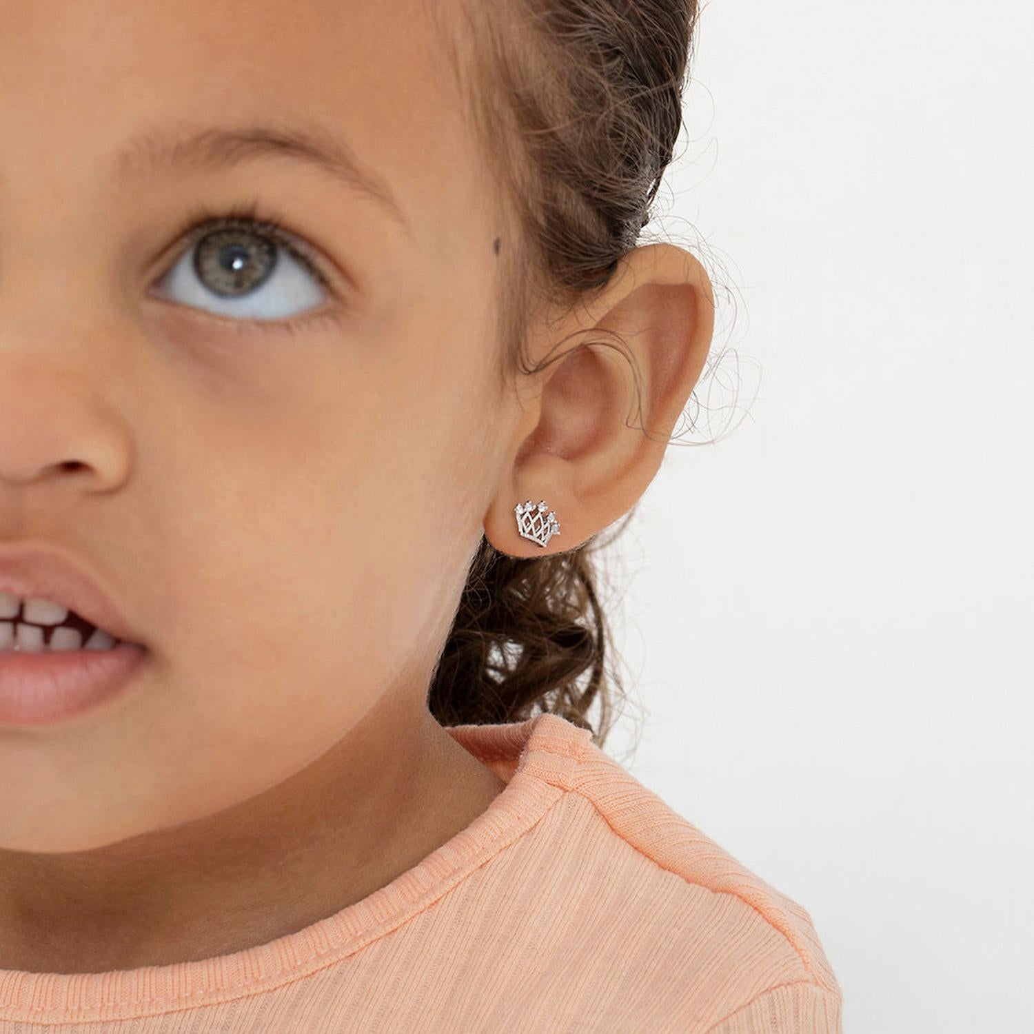 Silver crown earrings girls wearing delicate small crown studs by In Season Jewellery