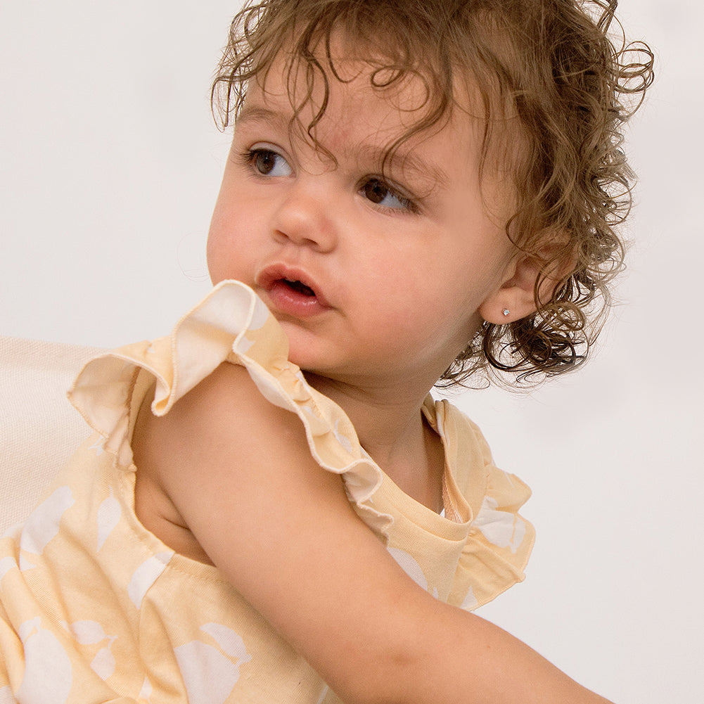 3mm kids safe earrings with secure backs worn by toddler girl in yellow dress from In Season Jewellery