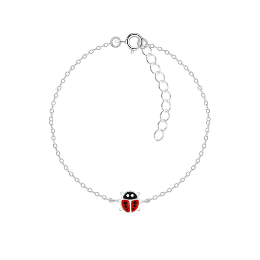 Kids silver ladybird charm bracelet from Melchior Jewellery with delicate chain and red enamel ladybird charm