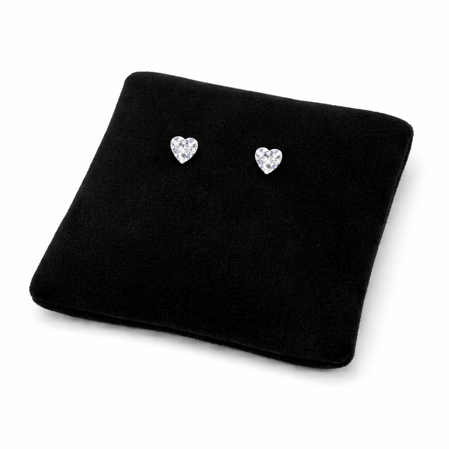 3mm silver heart earrings for girls displayed on black cushion by Melchior Jewellery