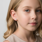 Melchior Jewellery 4mm screw back earrings for kids worn by a young girl with blonde hair