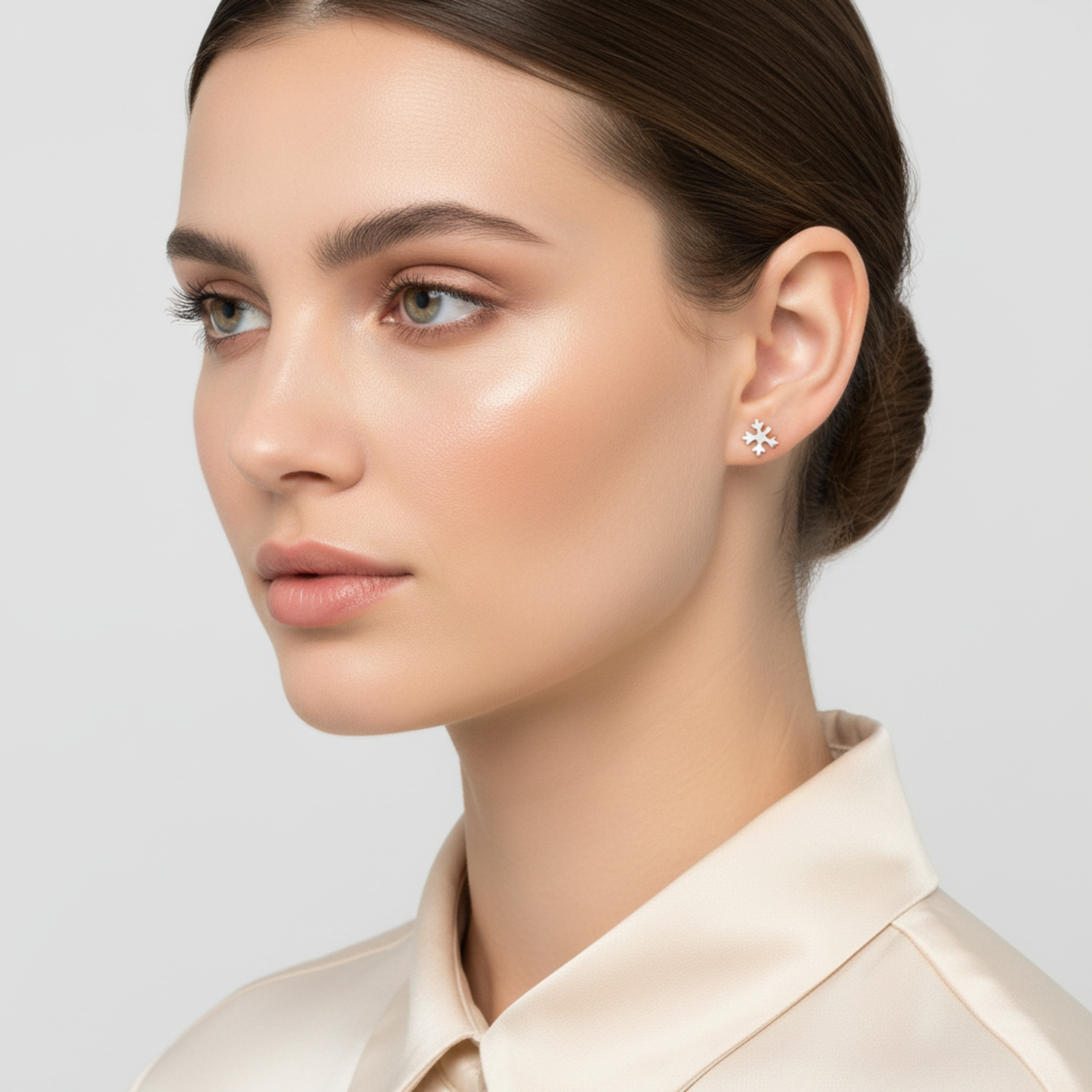 925 sterling silver snowflake earrings worn by woman with elegant hairstyle from Melchior Jewellery