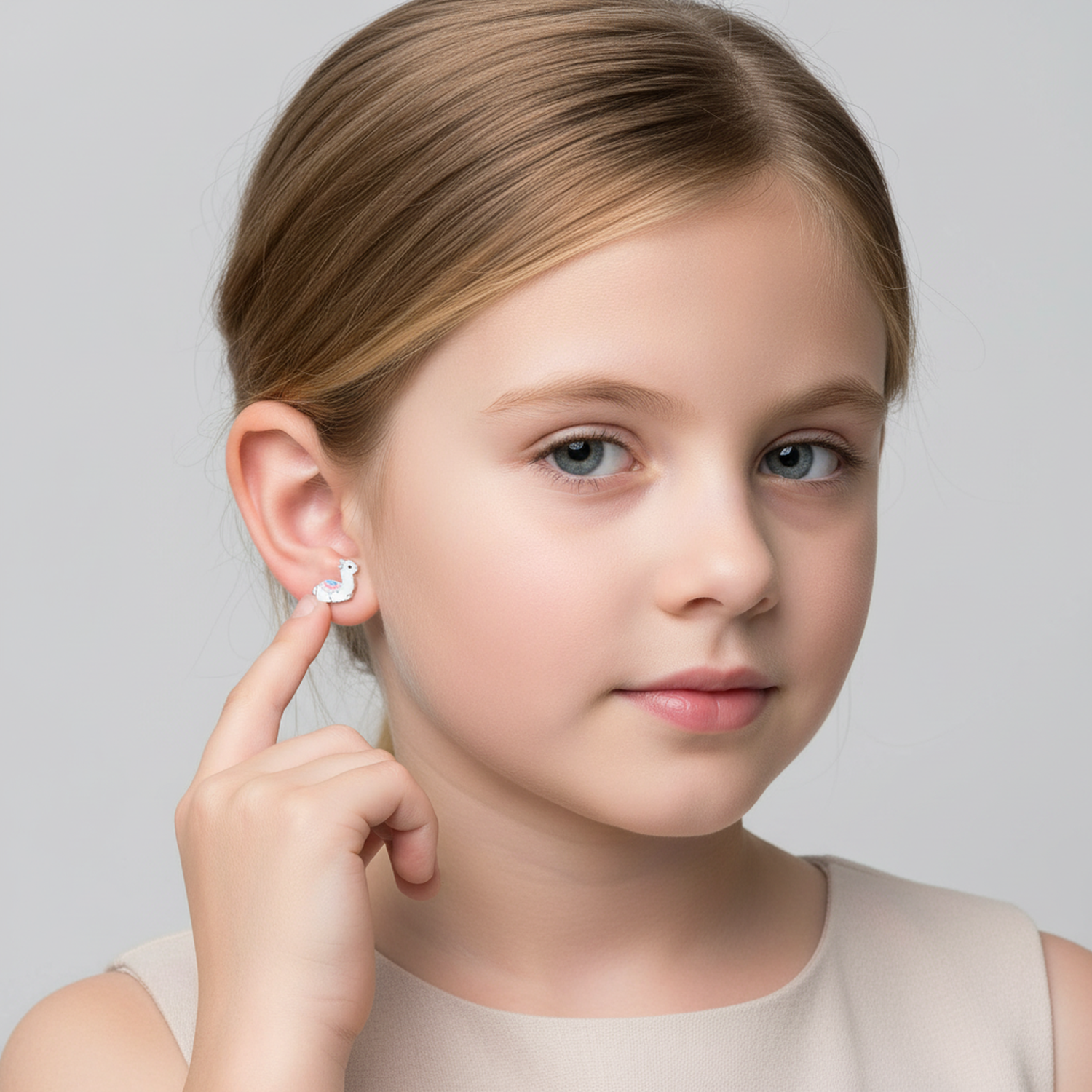 Melchior Jewellery alpaca stud earrings for kids worn by young girl with light brown hair