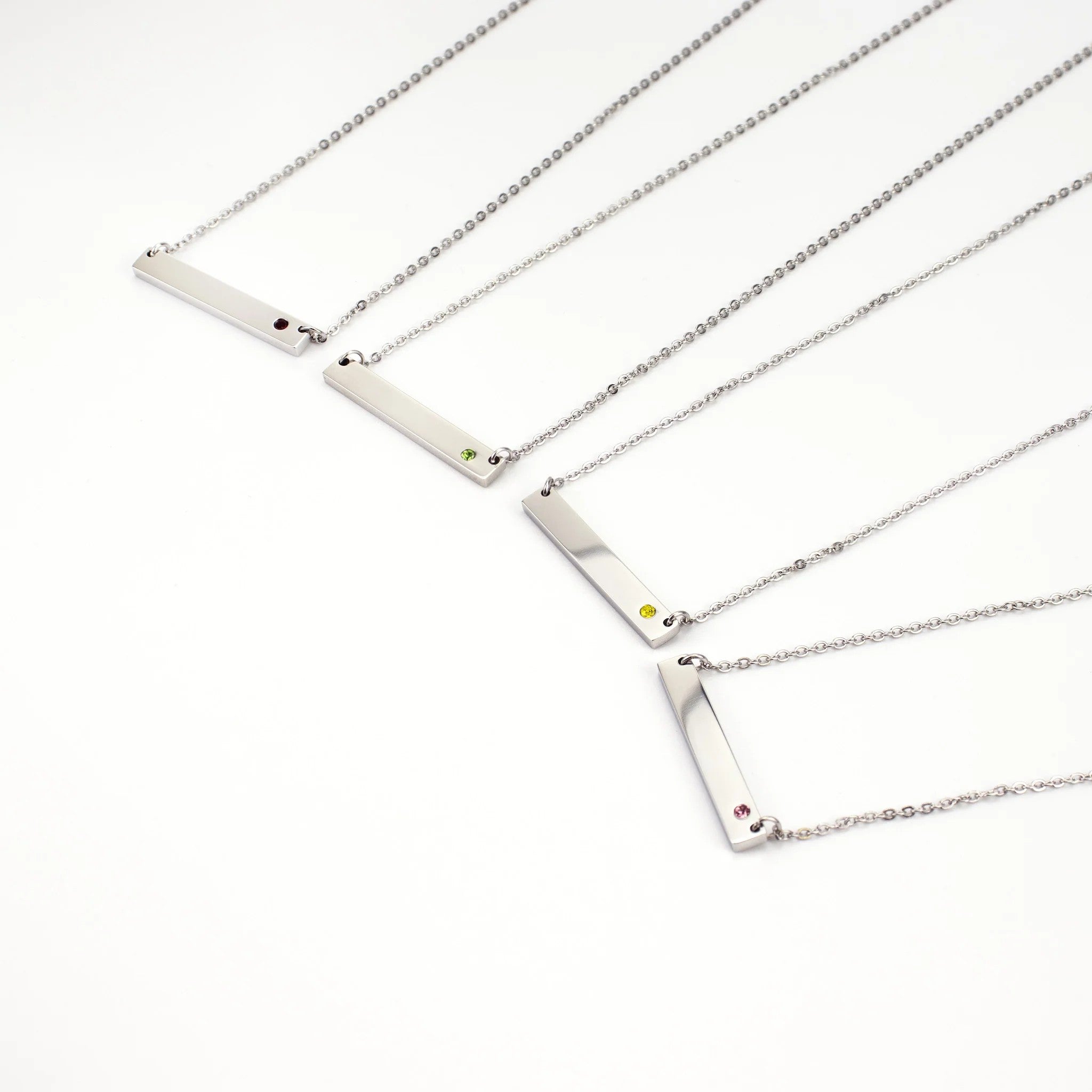 Silver Birthstone Bar Necklace collection by Melchior Jewellery featuring red, green, yellow and pink gemstone accents