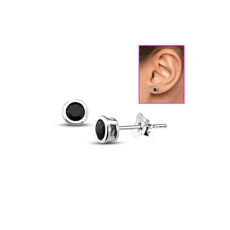 Melchior Jewellery round sterling silver stud black cubic zirconia earrings shown with inset ear