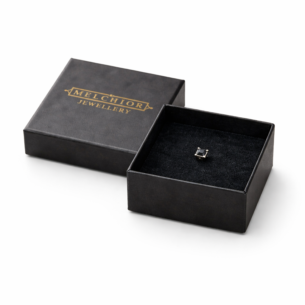 Melchior Jewellery black square stud earring for men displayed in a black branded jewellery box