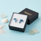 Blue crystal dolphin stud earrings for kids in a Melchior Jewellery black presentation box