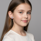 Blue crystal dolphin stud earrings for kids worn by girl with long brown hair from Melchior Jewellery