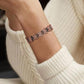 Melchior Jewellery copper butterfly design magnetic therapy bracelet on wrist showing floral link details