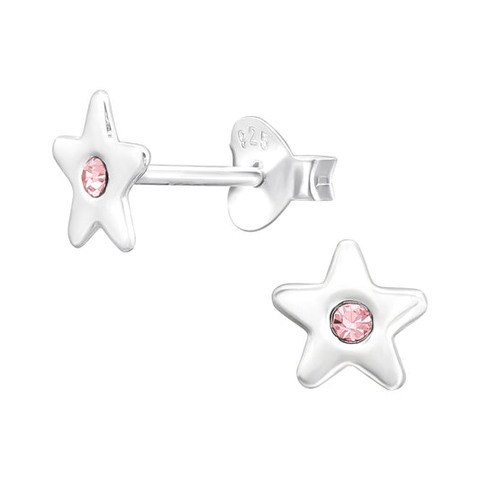 Children's silver star earrings by Melchior Jewellery with pink gemstone centre studs