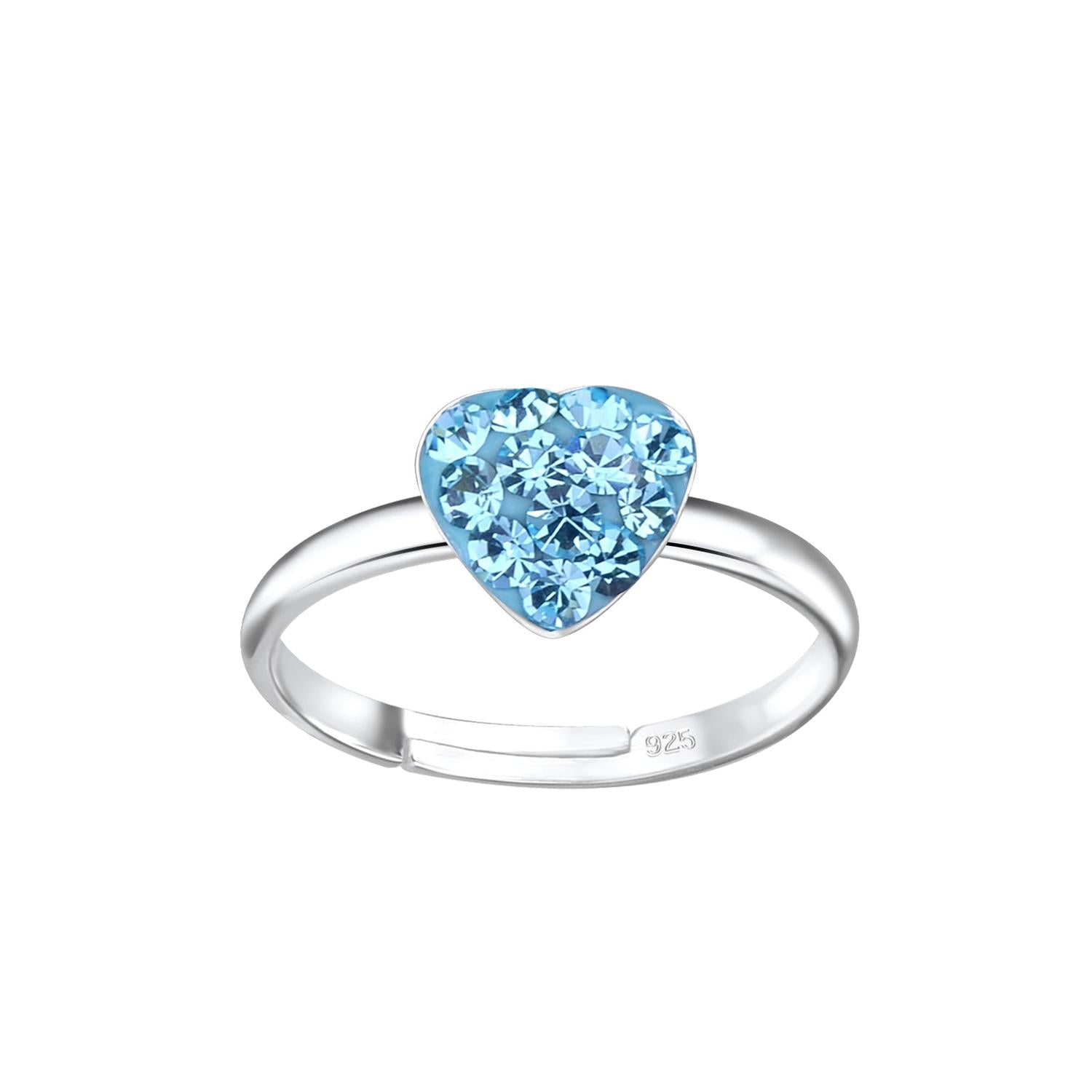 Childrens sterling silver heart ring by Melchior Jewellery with a sparkling blue gemstone cluster heart on a polished silver band