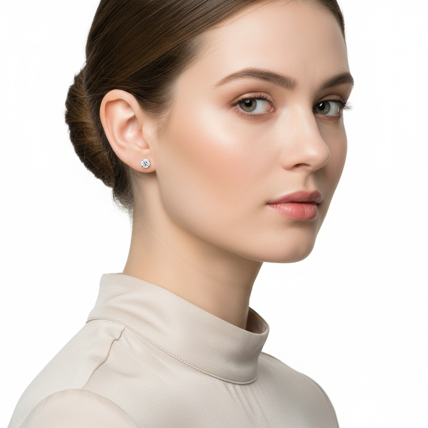 Melchior Jewellery clear round cubic zirconia earrings worn by woman with fair skin and brown hair in beige top