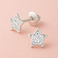 Melchior Jewellery crystal star screw back earrings for children with sparkling stones on pink background