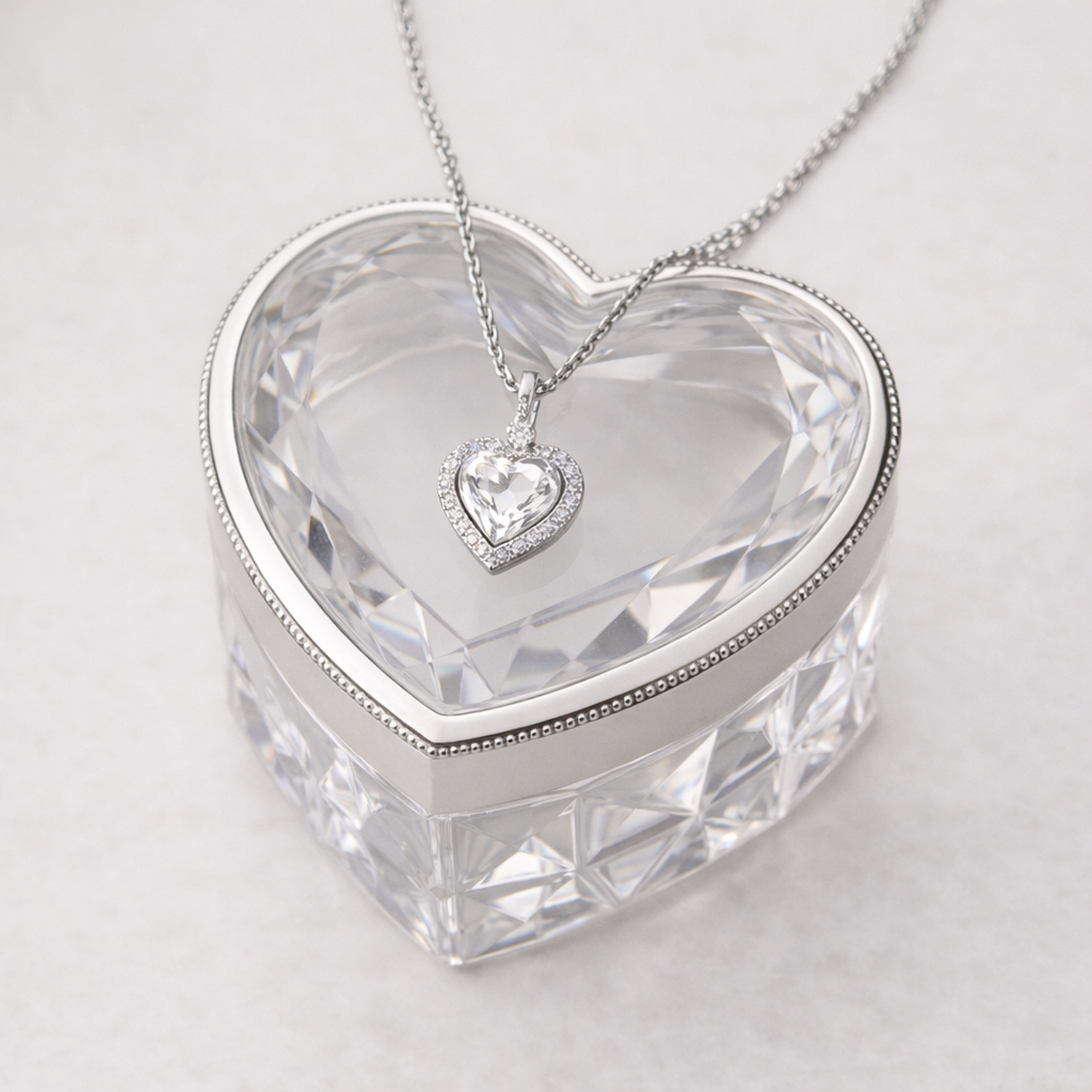 Melchior Jewellery cubic zirconia heart halo pendant necklace on a heart-shaped crystal box