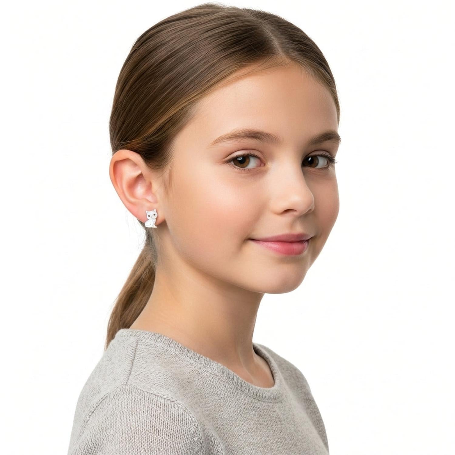 Cute cat stud earrings for kids worn by a girl with a grey sweater from Melchior Jewellery