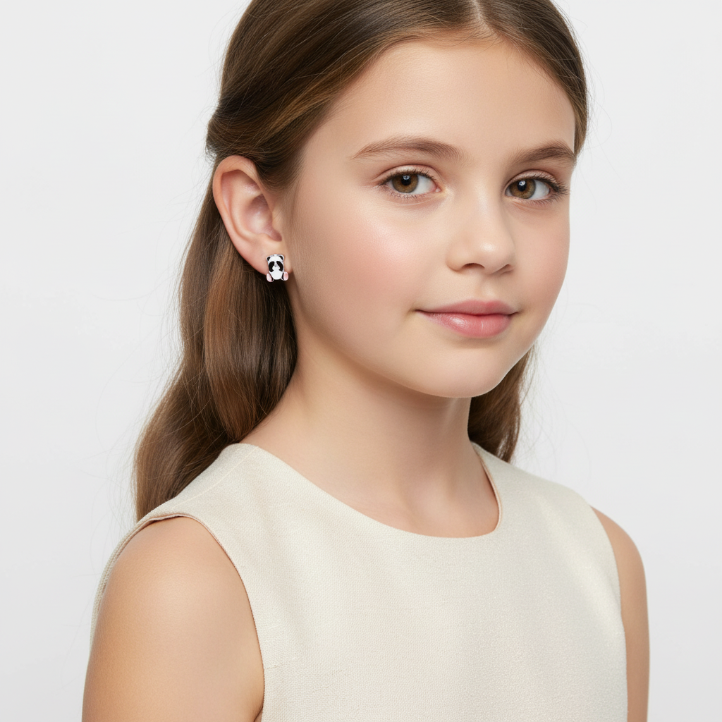 Young girl wearing cute panda earrings for girls by Melchior Jewellery with a white top