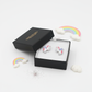 Cute silver unicorn earrings for children from Melchior Jewellery in black gift box with rainbow decorations