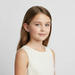 Young girl wearing CZ unicorn earrings for girls by Melchior Jewellery in a white dress