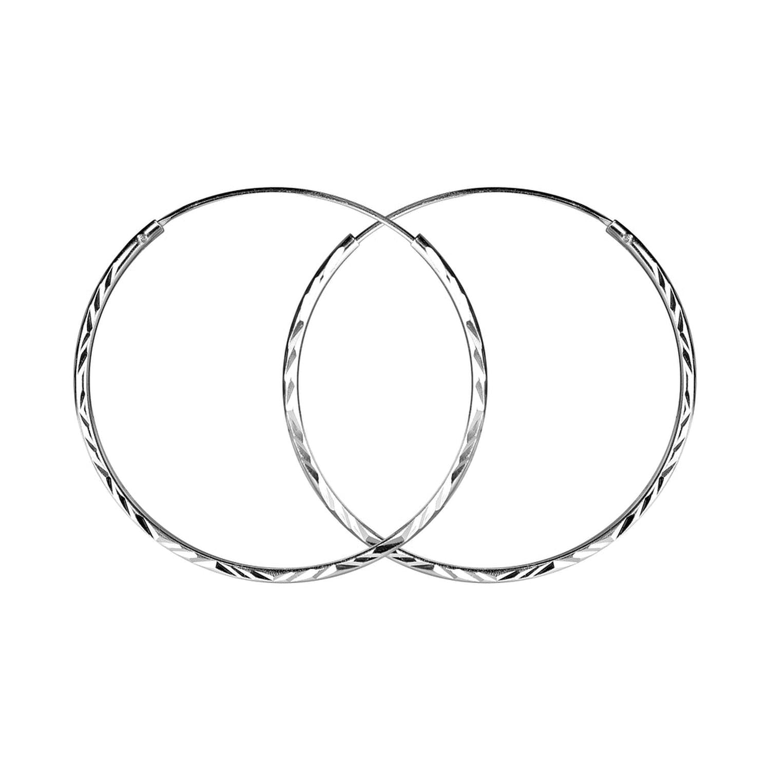 Melchior Jewellery diamond cut silver hoop earrings for women with intricate faceted design