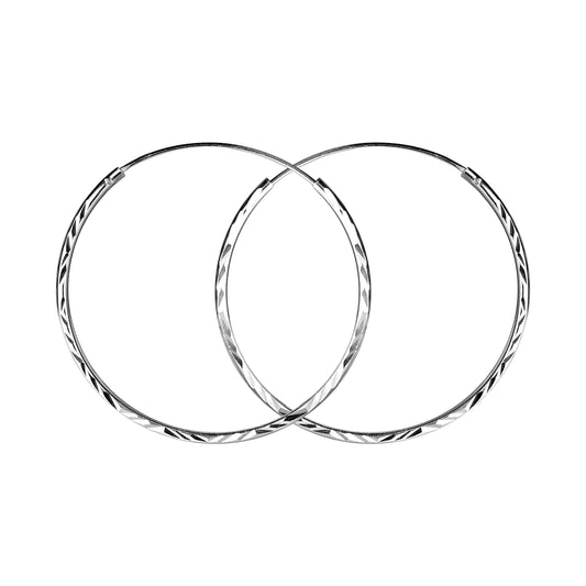Melchior Jewellery diamond cut silver hoop earrings for women with intricate faceted design
