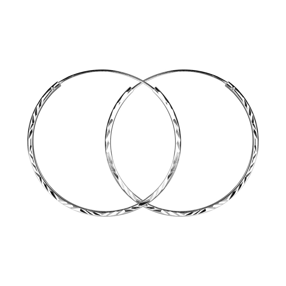 Melchior Jewellery diamond cut silver hoop earrings for women with elegant twisted design
