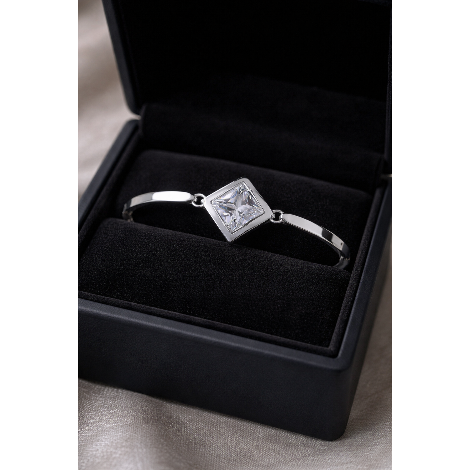 Sentiell diamond shape cubic zirconia bracelet in silver setting displayed in black jewellery box