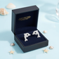 Melchior Jewellery dolphin earrings with crystals for children presented in a black gift box with seashell decorations