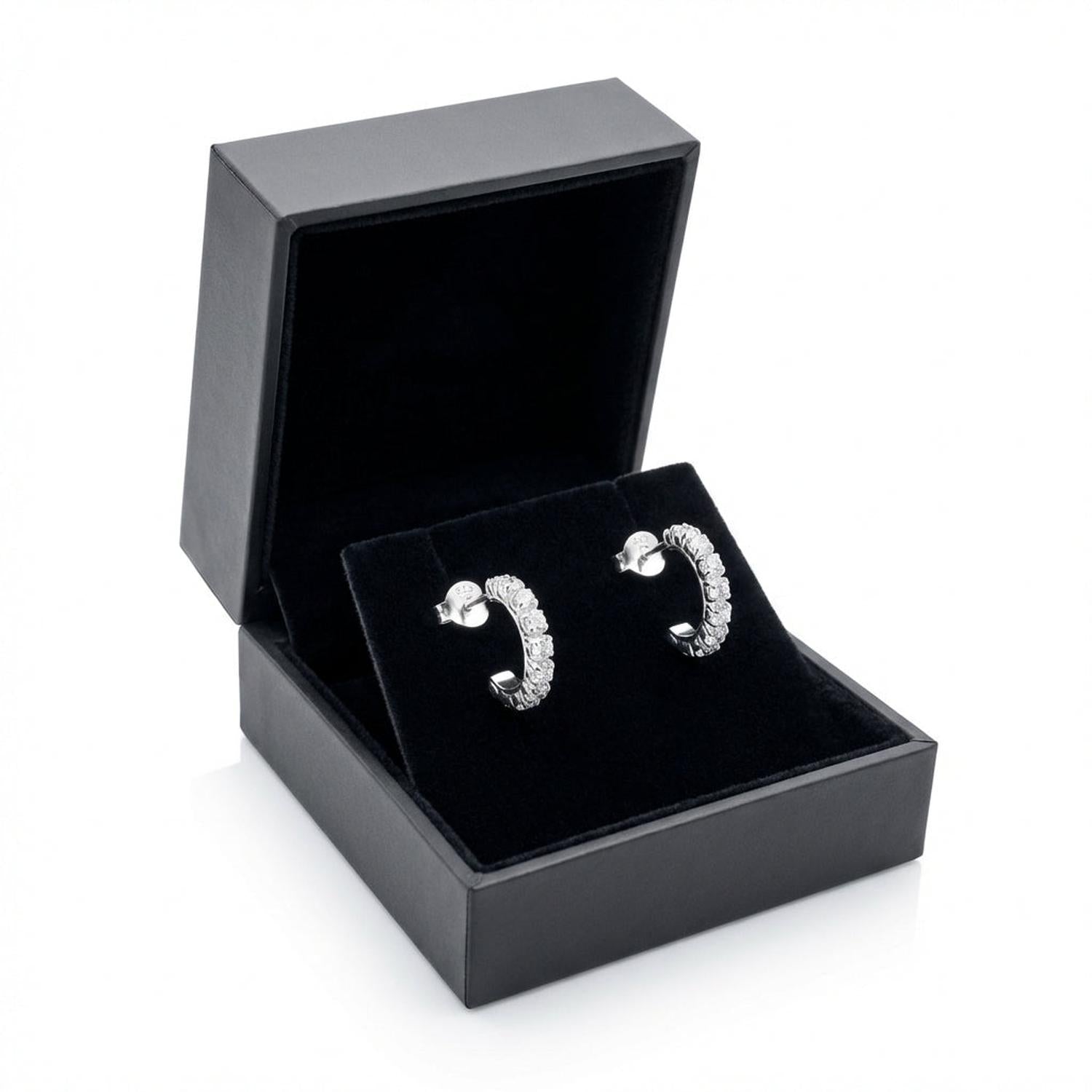 Elegant silver half hoop earrings for gifts displayed in a black jewellery box by Melchior Jewellery