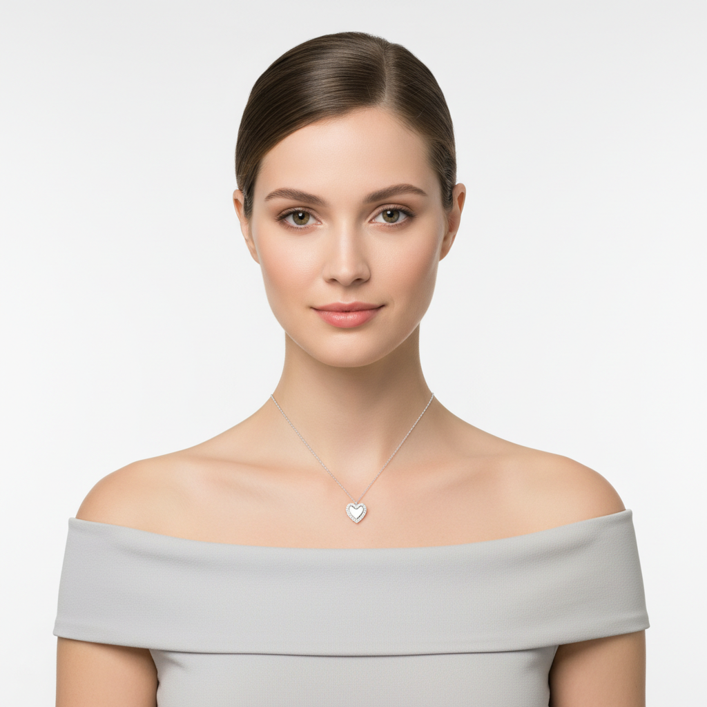 Elegant silver necklace for her with heart pendant worn by woman in off-shoulder grey top