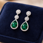 Melchior Jewellery Emerald Icon Drops Earrings with green teardrop gemstone and surrounding crystals