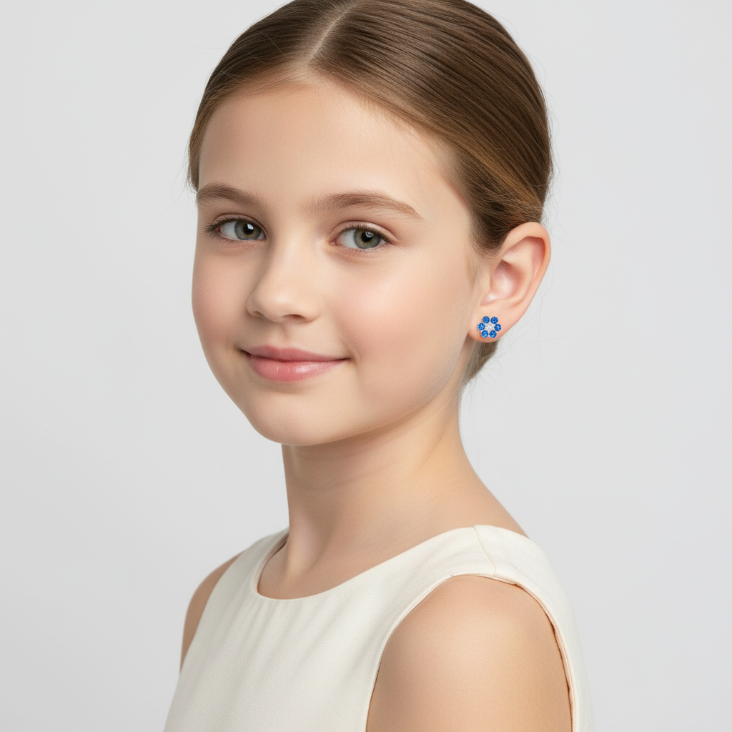 Melchior Jewellery flower stud earrings for children worn by young girl with blue floral design