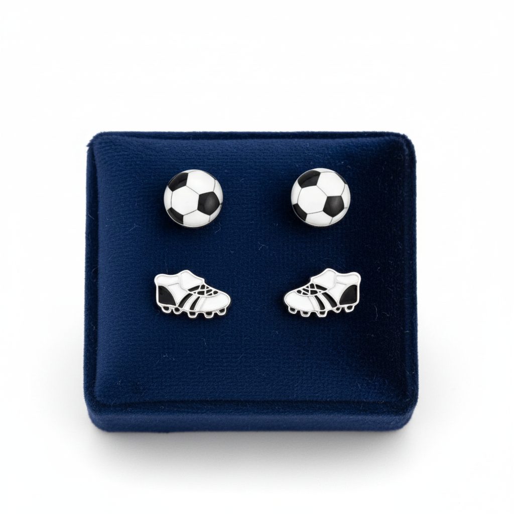 Melchior Jewellery childrens football boot and ball earrings set displayed on navy blue cushion