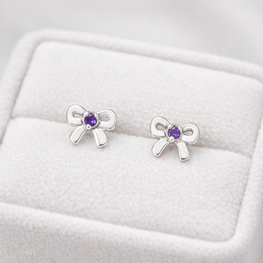 Melchior Jewellery girls amethyst birthstone earrings in silver bow design with purple amethyst stones