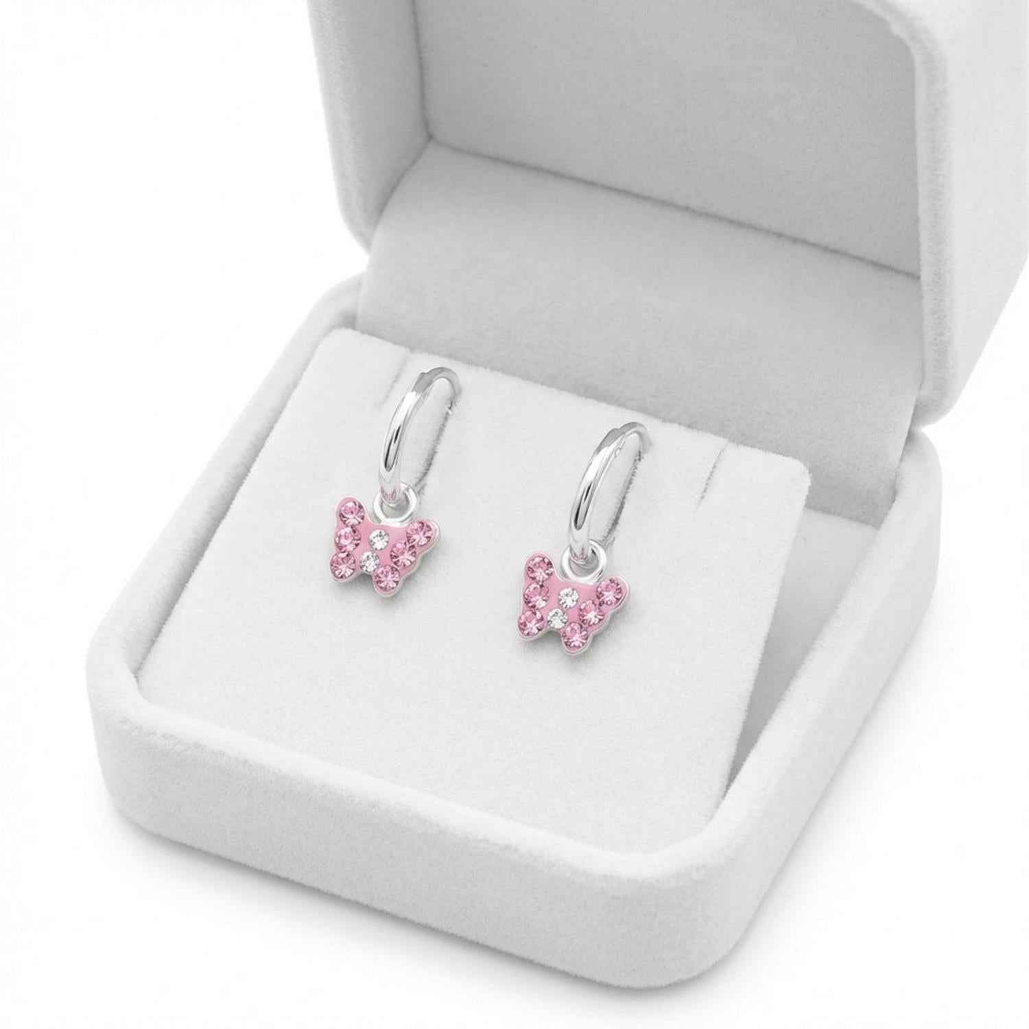 Girls butterfly earrings sterling silver with pink crystals displayed in a white jewellery box by Melchior Jewellery