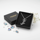 Melchior Jewellery girls butterfly triple pendant necklace in silver displayed in an open black gift box